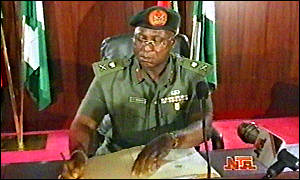 _109569_Gen_Abubakar_signs_documents_at_swearing_in_on_Nigerian_TV_ap_300_09-06-98